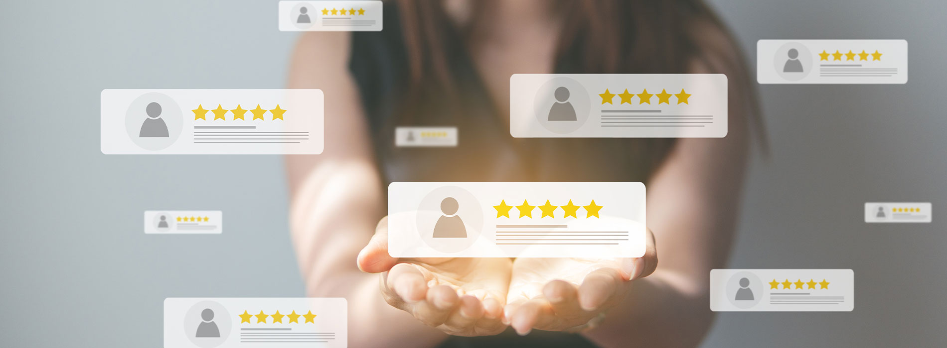 The image shows a hand holding a tablet with a star rating graphic on the screen, indicating high customer satisfaction or approval.